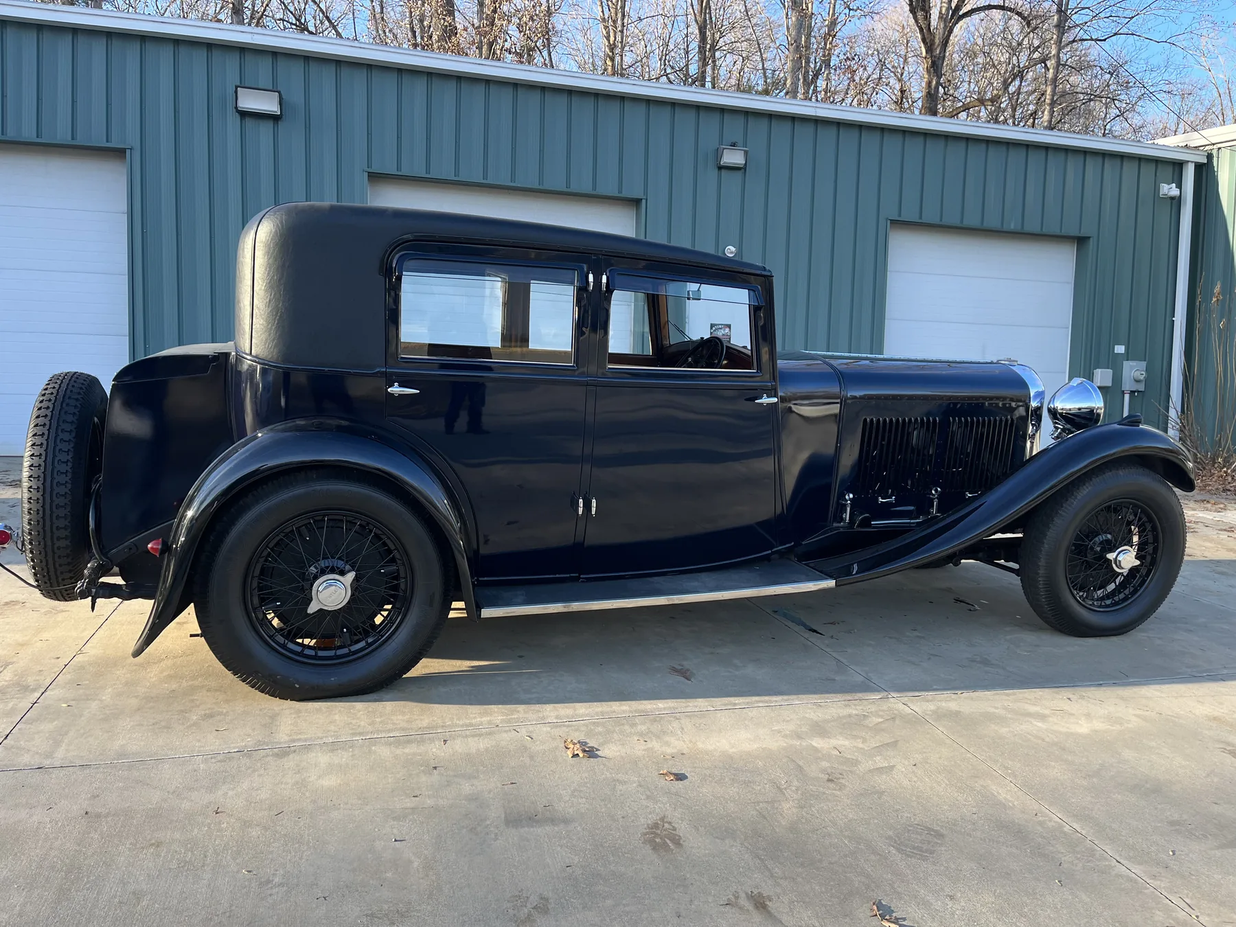 Black vintage motorcar shown in profile