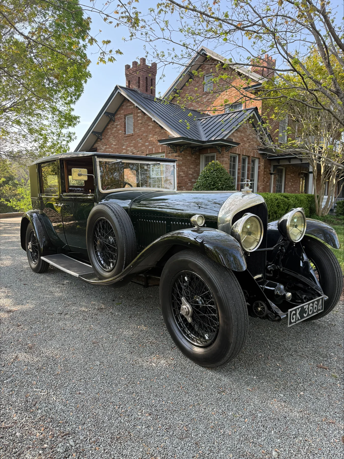 Dark vintage motorcar photographed from the front